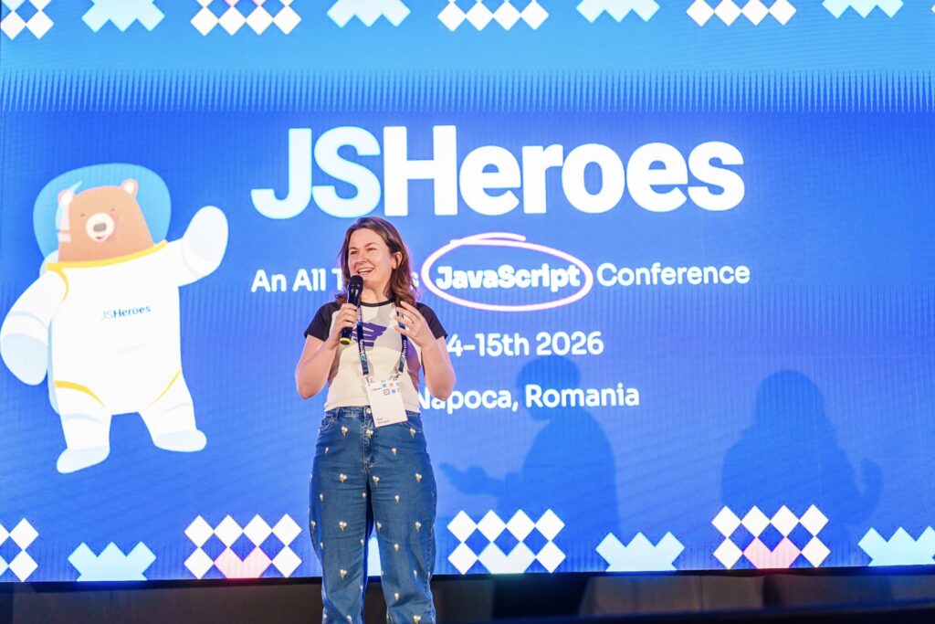 Cyd standing on stage at JS Heroes