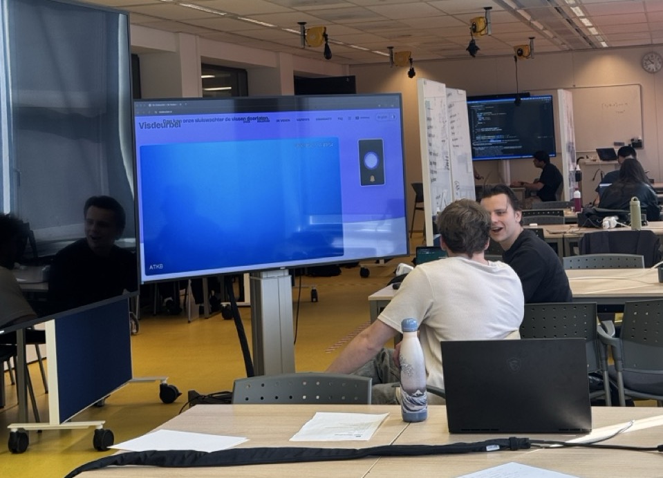 Students watching the fish doorbell on a large screen in our classroom